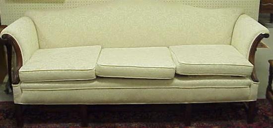 Appraisal: Chippendale style camel back sofa white upholstery mahogany frame with