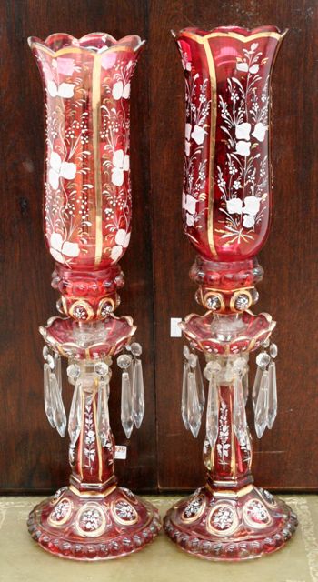 Appraisal: A pair of ruby glass lustres painted with floral sprays