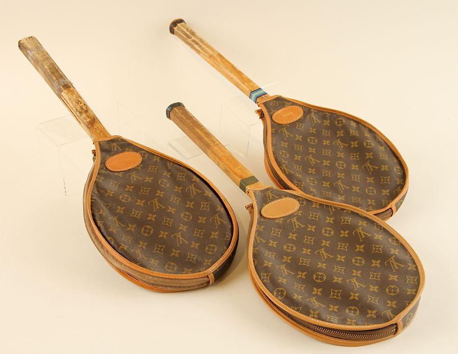 Appraisal: WOOD TENNIS RACKETS WITH LOUIS VUITTON COVERS A collection of