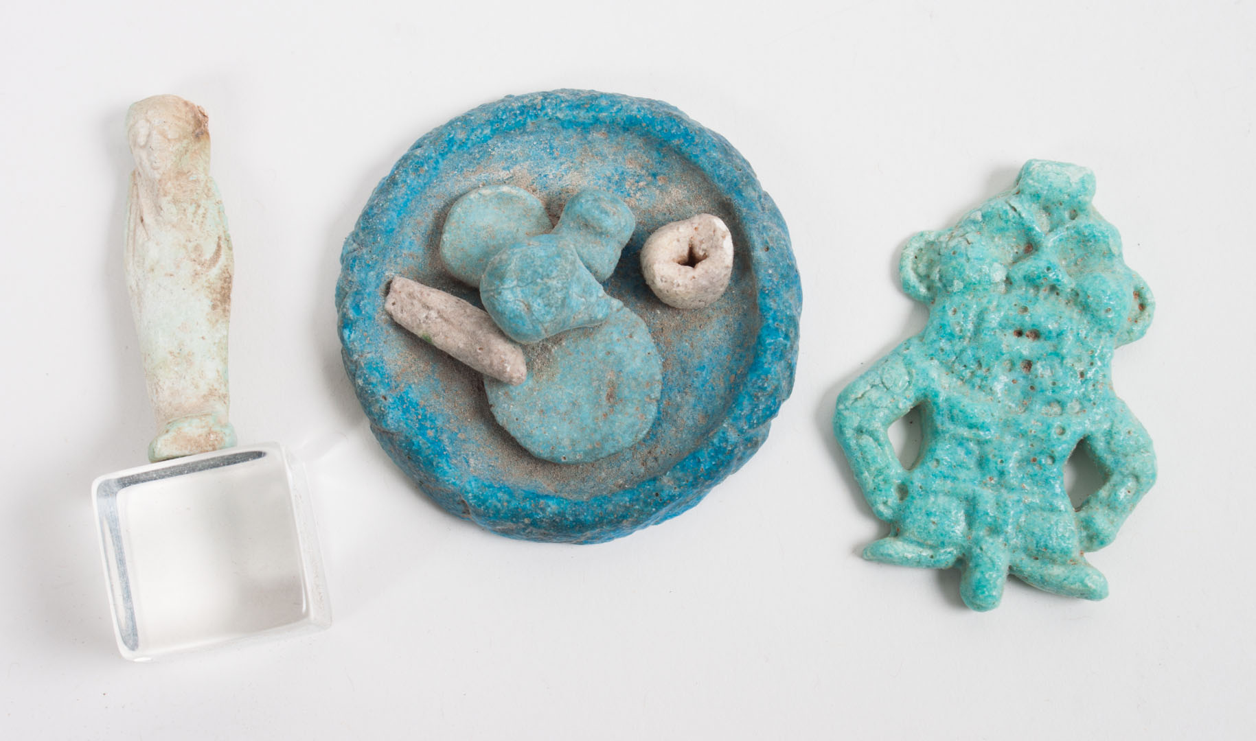 Appraisal: Three ancient Egyptian faience objects comprising an amulet modeled as