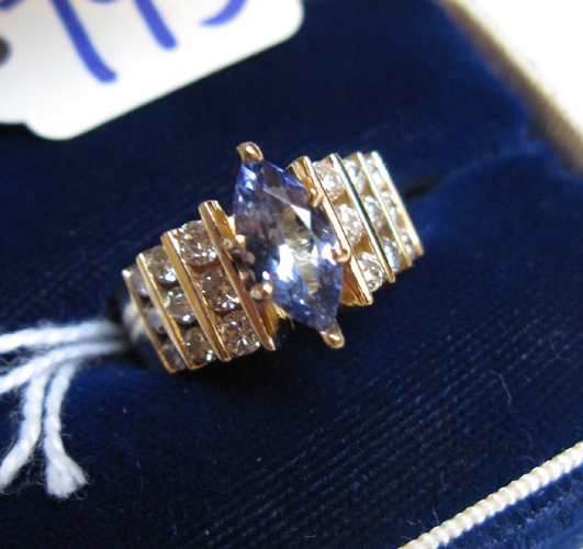 Appraisal: SAPPHIRE DIAMOND AND FOURTEEN KARAT GOLD RING centering a marquise-cut