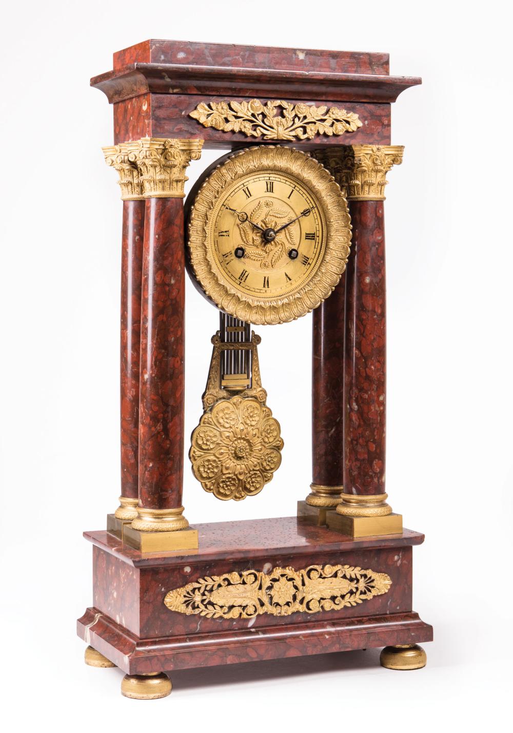 Appraisal: French Rouge Royale Marble and Gilt Bronze Portico Clock early