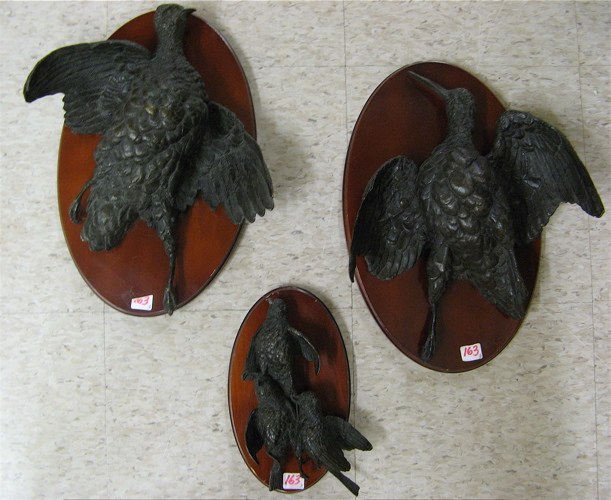 Appraisal: THREE MAHOGANY AND PATINATED BRONZE GAME BIRD TROPHY MOUNTS the