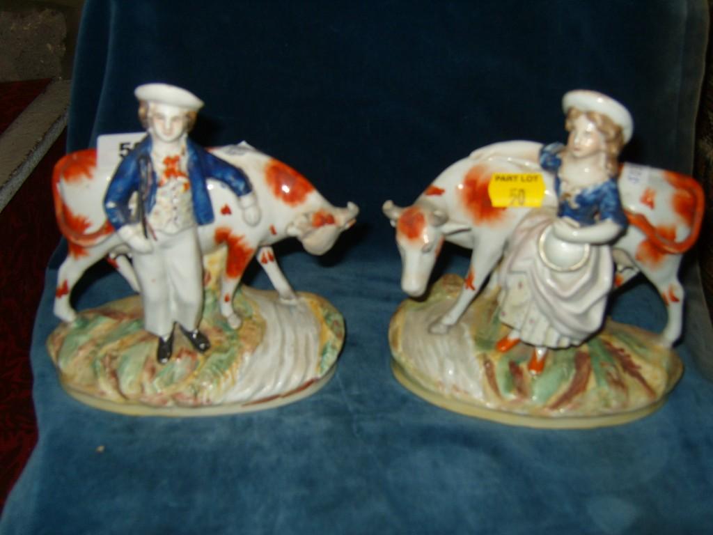 Appraisal: A pair of th century Staffordshire figure groups a cowherd