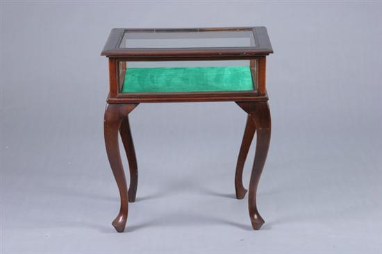 Appraisal: GEORGIAN STYLE MAHOGANY VITRINE th century Velvet-lined display case raised