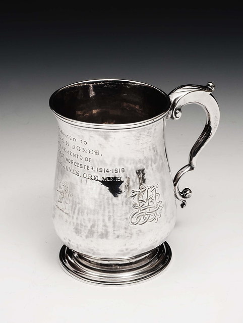 Appraisal: A Georgian silver half pint mugof baluster form on pedestal