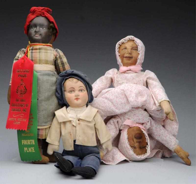 Appraisal: Lot of Cloth Dolls Bruckner boy with mask face all