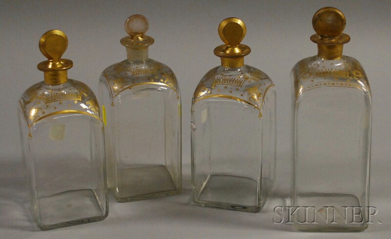 Appraisal: Four Gilt-decorated Colorless Blown Glass Decanters square form with gilt