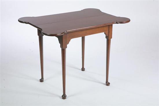 Appraisal: QUEEN ANNE STYLE TABLE Mahogany with a shaped top and