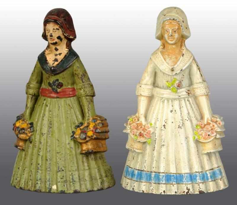 Appraisal: Lot of Cast Iron Woman Doorstops Description Both women holding