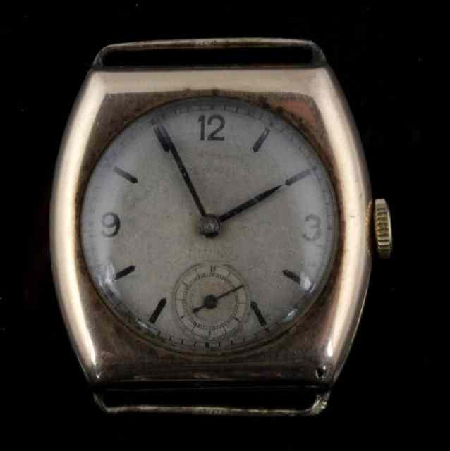 Appraisal: A gold wristwatch circa with plain steel dial the case