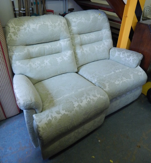 Appraisal: A modern double reclining two seat sofa upholstered in cream