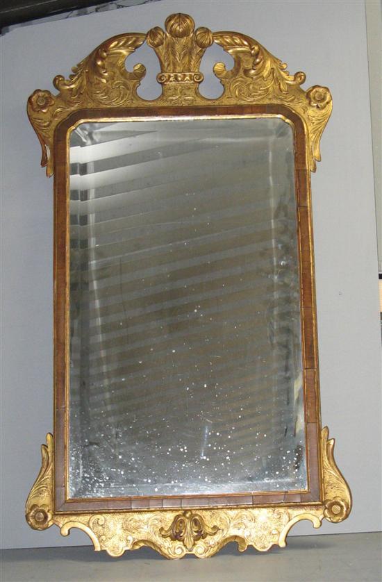 Appraisal: th century mahogany and gilt frame wall mirror the top