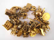 Appraisal: A carat gold charm bracelet with approx charms including a