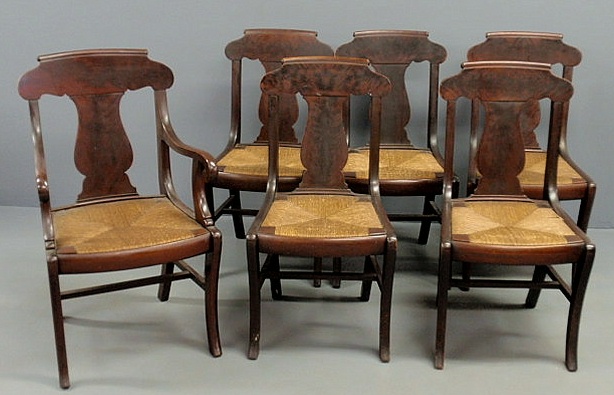 Appraisal: Set of seven mahogany saber leg chairs with rush seats