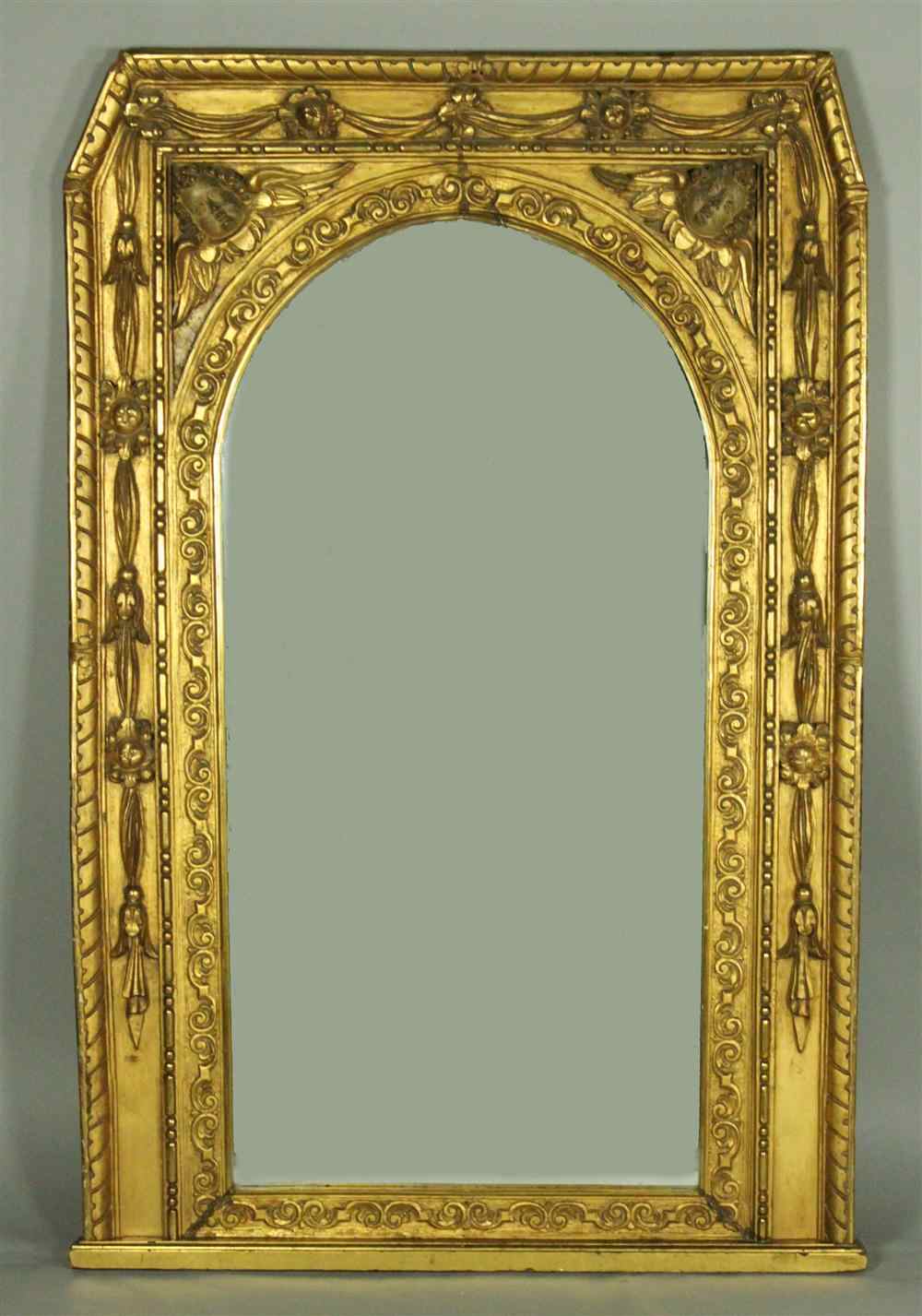 Appraisal: OVERSIZE CARVED GILTWOOD MIRROR WITH CHERUBS th century having a