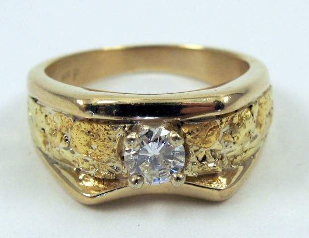 Appraisal: MAN'S DIAMOND AND FOURTEEN KARAT GOLD RING set with a