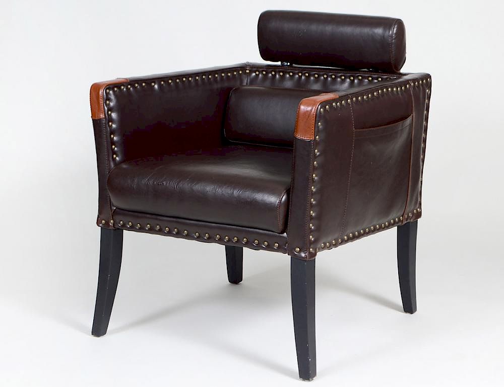 Appraisal: LEATHER UPHOLSTERED CLUB CHAIR Modern With an oval headrest set