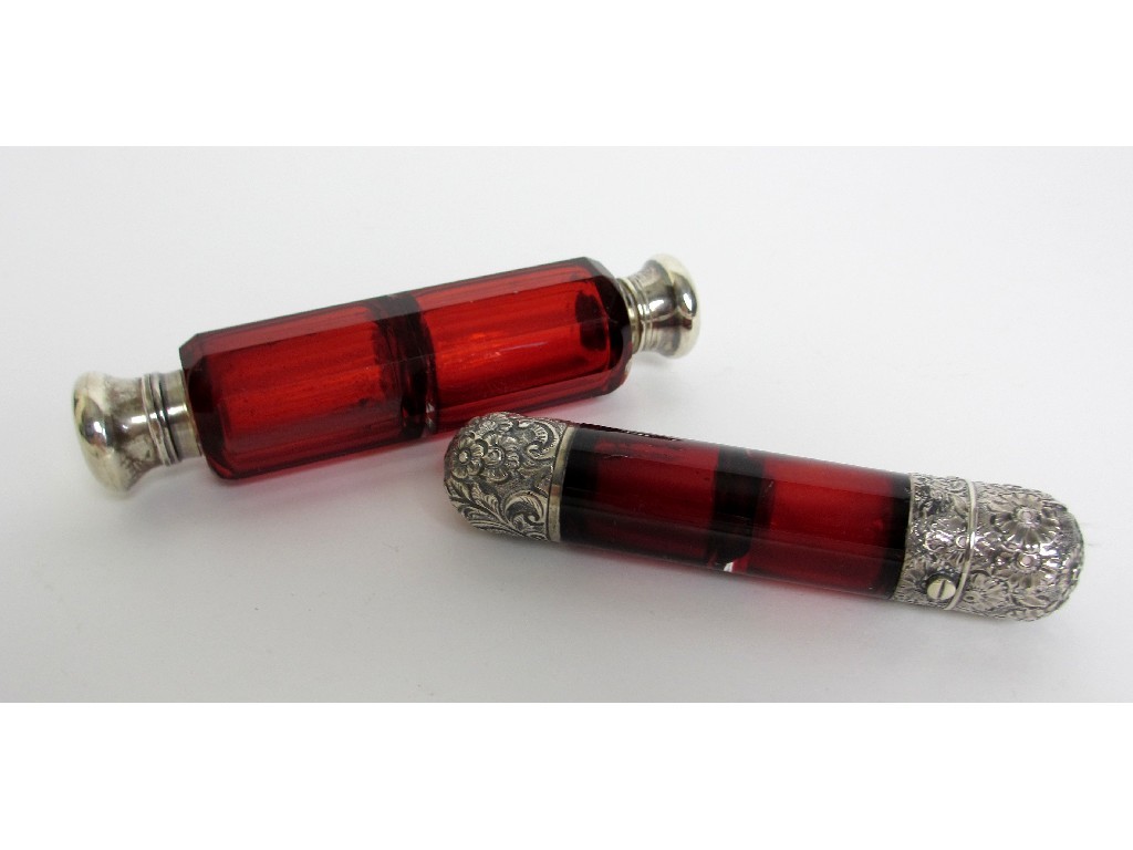 Appraisal: A Victorian red faceted glass double scent bottle with white