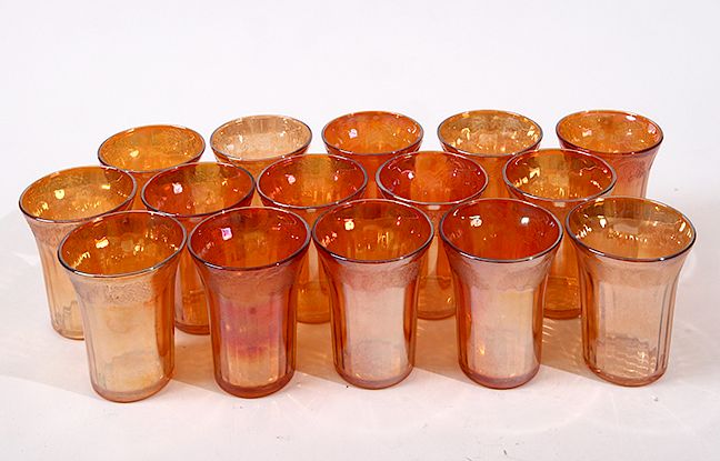 Appraisal: Carnival Tumblers A group of fifteen fluted carnival glass tumblers