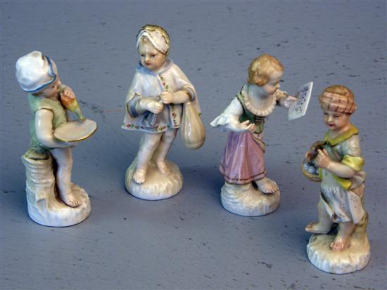 Appraisal: Four Berlin KPM figures modelled as a boy holding a