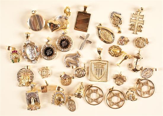 Appraisal: Assorted gold and stone pendants and charms grams