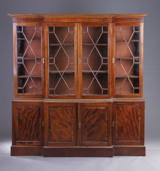 Appraisal: ENGLISH REGENCY STYLE MAHOGANY BREAKFRONT BOOKCASE early th century Molded-edge