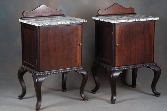 Appraisal: Matching pair of vintage mahogany marble top Bedside Stands with