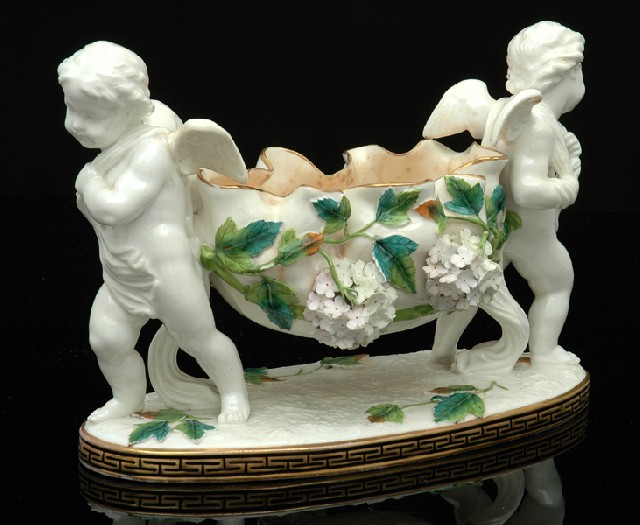 Appraisal: A MOORE BROTHERS PORCELAIN COMPORT Circa The naturalistically modelled bowl