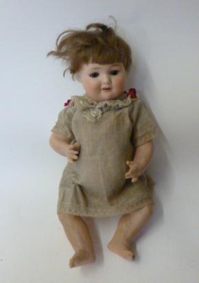 Appraisal: An Armand Marseille bisque head girl doll with brown glass