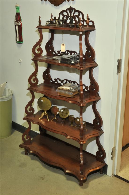 Appraisal: VICTORIAN WHAT-NOT-SHELF Walnut having pierced galleries scrolled supports and five