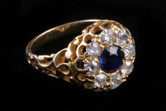 Appraisal: ANTIQUE YELLOW GOLD DIAMOND AND SAPPHIRE RING Round sapphire surrounded