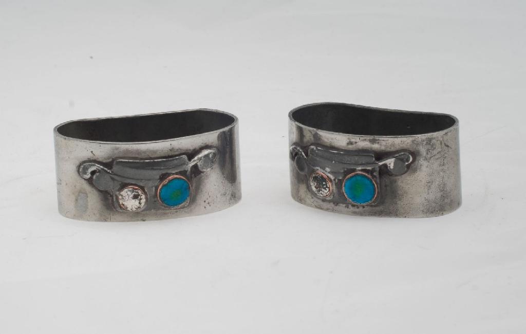 Appraisal: PAIR OF LIBERTY CO ENGLISH PEWTER NAPKIN RINGS each applied