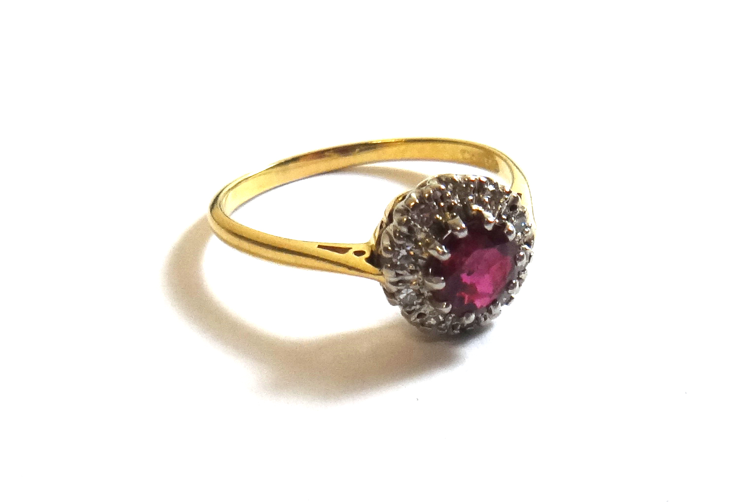 Appraisal: An ct gold ruby and diamond set circular cluster ring