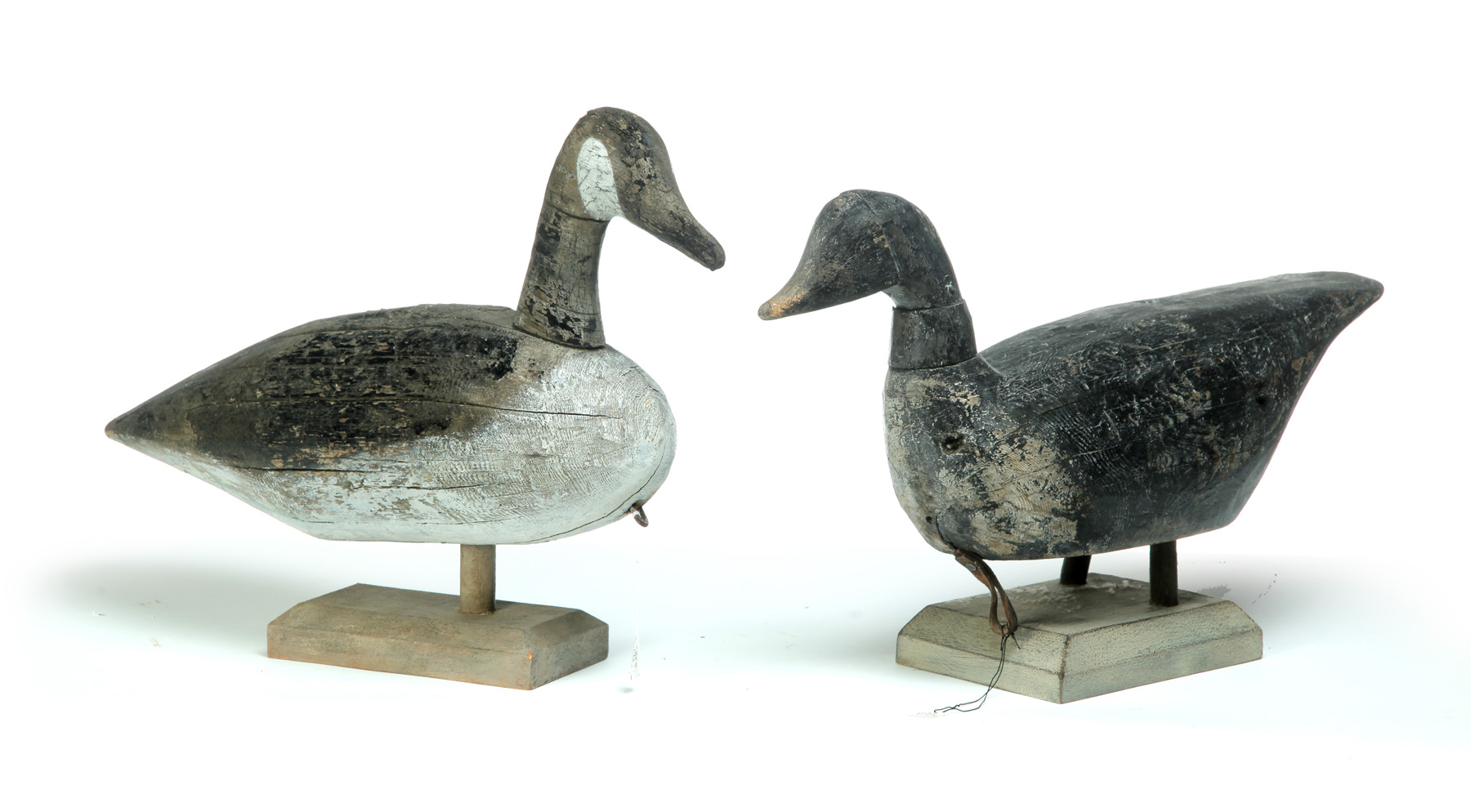 Appraisal: TWO WORKING CANADA GEESE DECOYS American th century pine Old