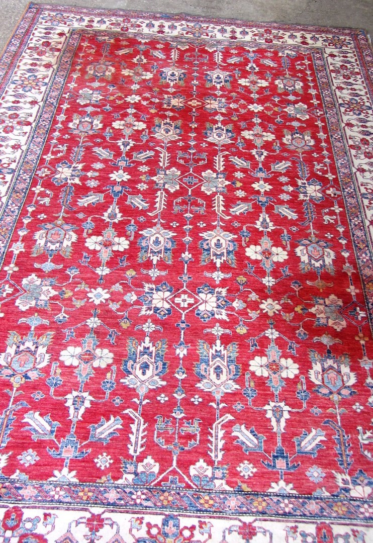 Appraisal: A large Kazak design carpet Pakistan modern the red ground