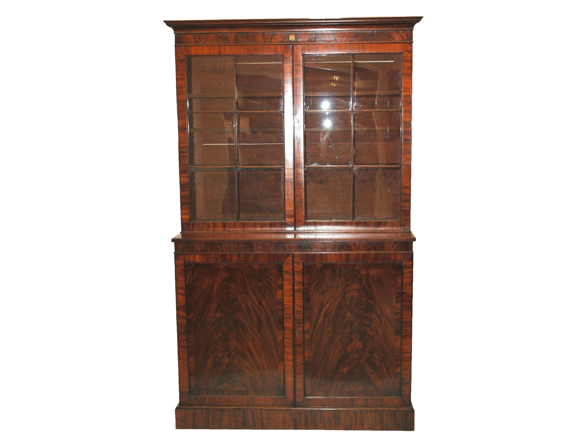 Appraisal: A th Century mahogany library display breakfront bookcasethe moulded cornice