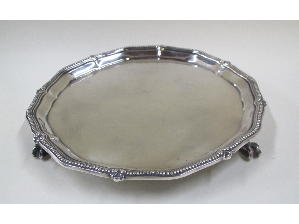 Appraisal: A silver card tray of shaped circular form on three