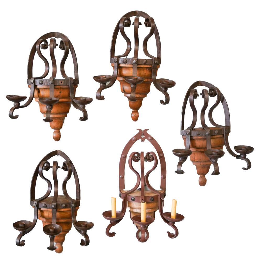 Appraisal: FIVE IRON WOOD WALL LIGHTSone brown-painted and wired for electricity