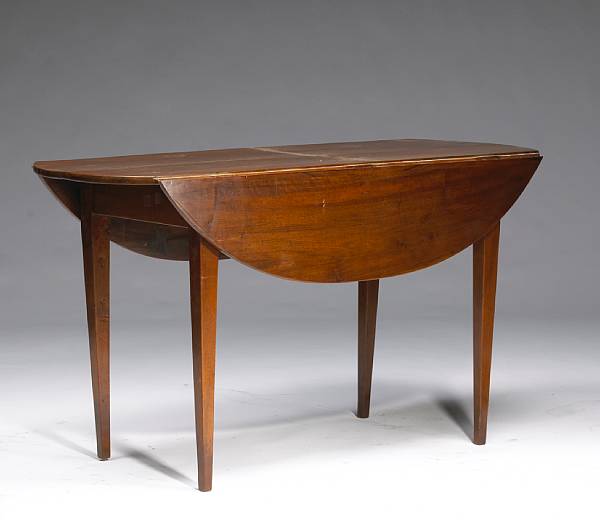 Appraisal: A Continental Neoclassical walnut drop leaf table height in extended