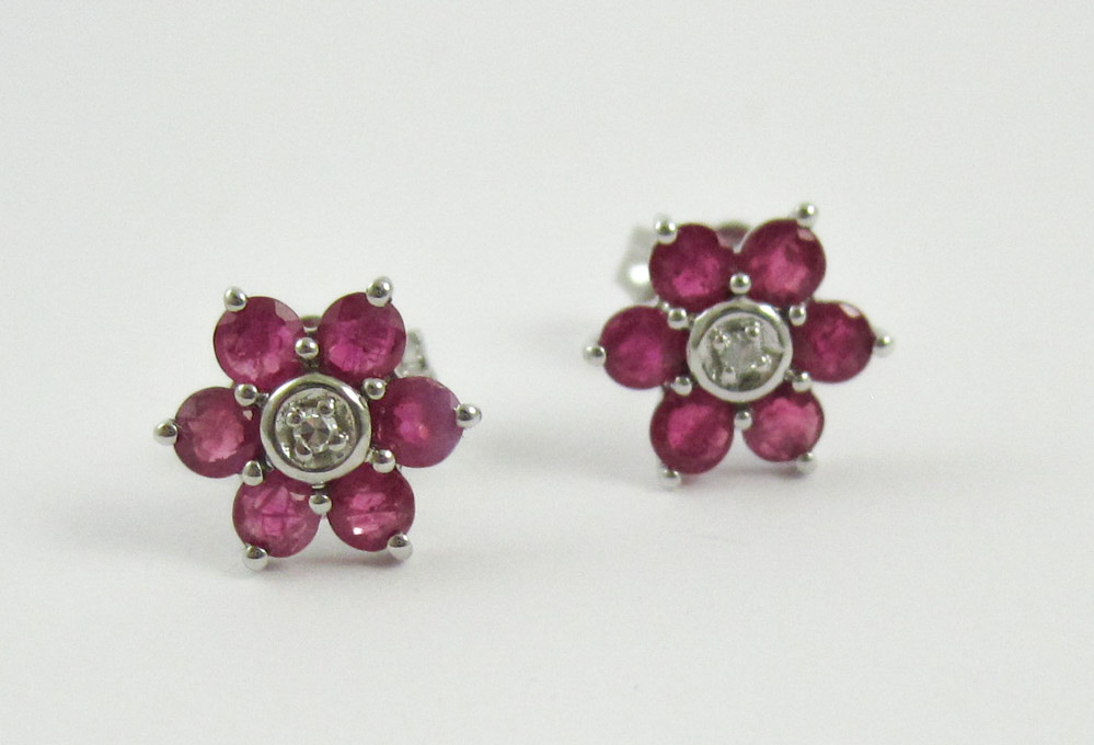 Appraisal: FOURTEEN KARAT WHITE GOLD RUBY AND DIAMOND EARRINGS each set