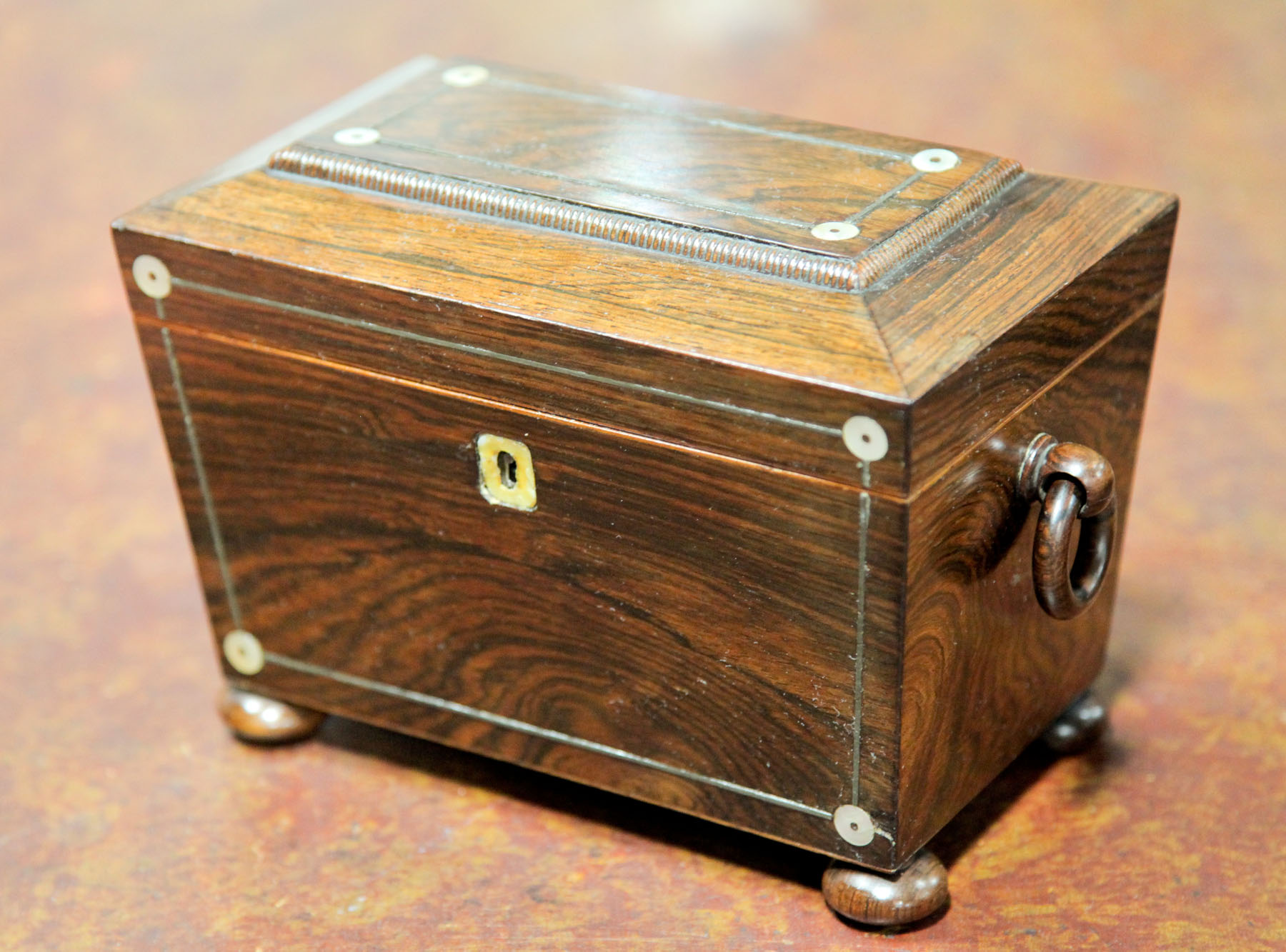 Appraisal: TEA CADDY English mid th century Footed caddy with rosewood