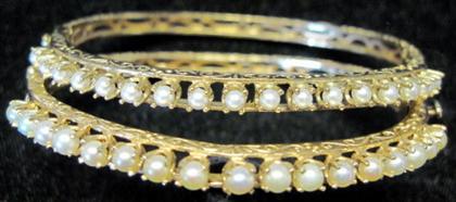 Appraisal: Two karat yellow gold pearl banglesEach featuring seventeen prong set