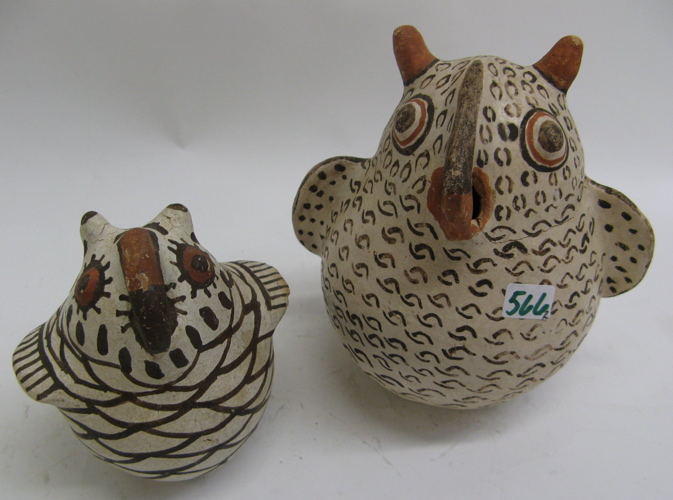 Appraisal: TWO FIGURAL ART POTTERY PIECES hand made rounded stylized owls