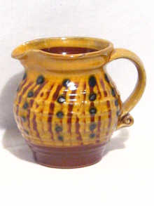 Appraisal: British Studio Pottery A ceramic cream jug by Harry Juniper