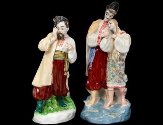 Appraisal: TWO RUSSIAN PORCELAIN FIGURES The first of a peasant male