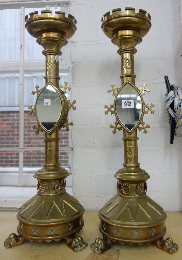 Appraisal: A pair of Victorian Gothic revival brass altar candlesticks late