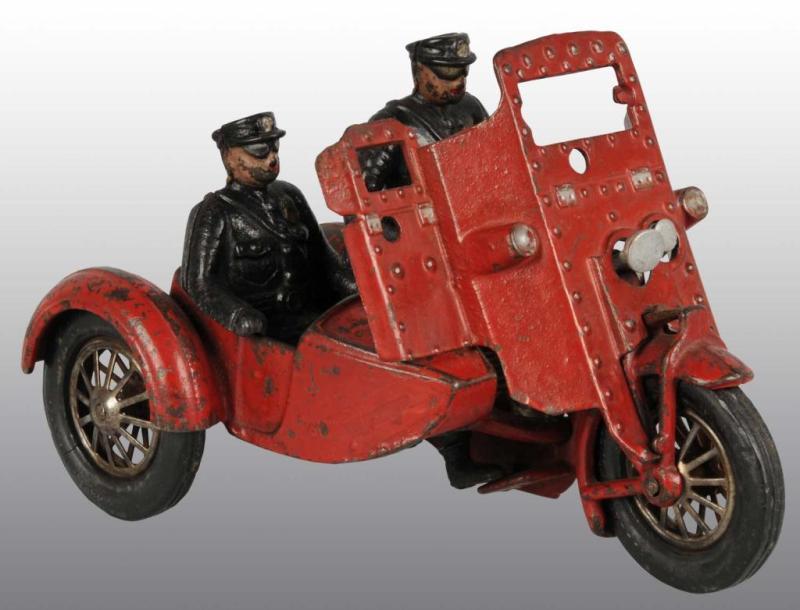 Appraisal: Cast Iron Indian Shielded Sidecar Motorcycle Toy Description Original passenger