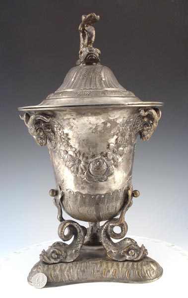 Appraisal: SILVERPLATE DOLPHIN RAMS HEAD COVERED VASE Large silverplate covered vase