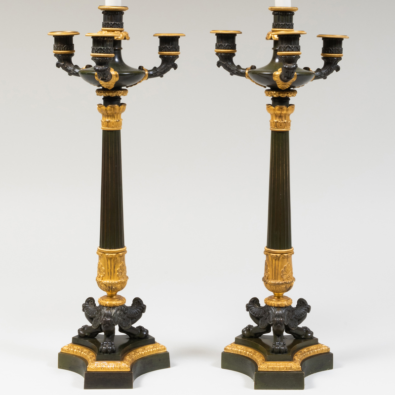 Appraisal: PAIR OF LOUIS PHILLIPPE PATINATED BRONZE AND PARCEL-GILT FOUR-LIGHT CANDLESTICKS